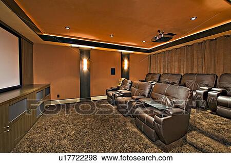 Stock Photo - Media room with leather furniture in luxury mansion. Fotosearch