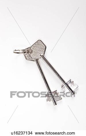Metal safe keys with key ring on white background View Large Photo Image Picture - Metal safe keys with key ring on white background. Fotosearch