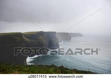 Stock Photography - Misty view over Cliffs of Moher. Fotosearch
