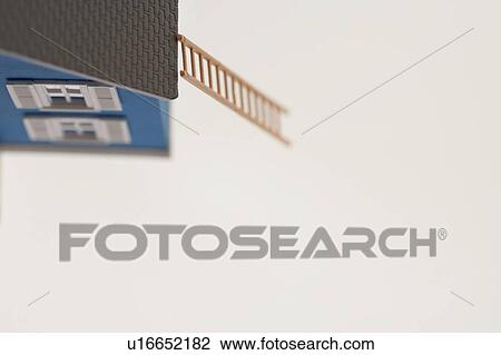 Stock Image - Model of house with ladder. Fotosearch