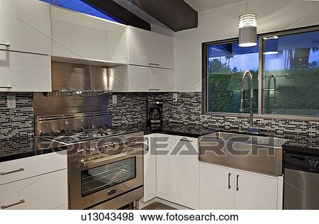 Stock Photo - Modern kitchen counter in mansion. Fotosearch