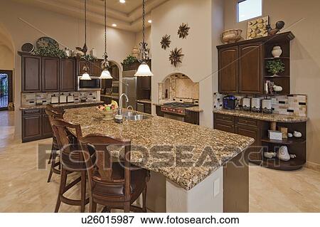 Stock Photo - Modern kitchen counter in mansion. Fotosearch