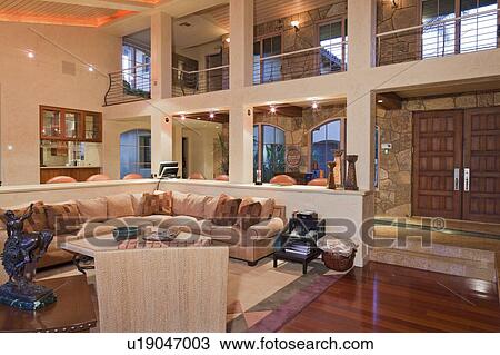 Stock Image - Modern living room interior design of manor house. Fotosearch