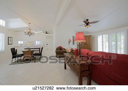 Stock Image - Modern living room interior with dining table and chair. Fotosearch