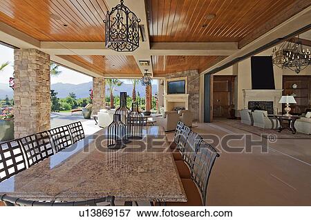 Stock Photo - Outdoor covered dining area and patio. Fotosearch