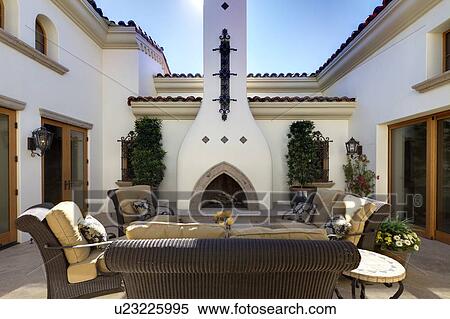 Stock Photography - Outdoor dining area in luxury villa. Fotosearch