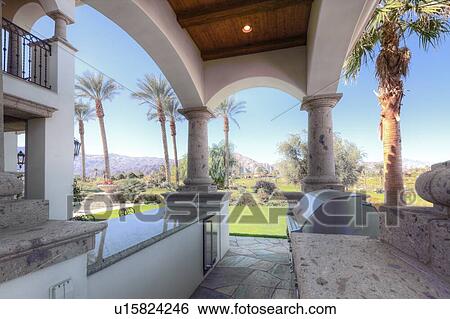 Stock Photograph - Outdoor kitchen and barbecue area in luxury villa. Fotosearch