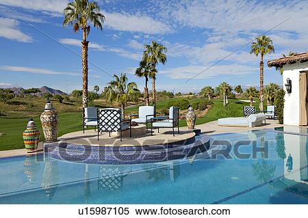 Outdoors seating furniture at poolside with landscape in background View Large Photo Image Stock Photography - Outdoors seating furniture at poolside with landscape in background. Fotosearch