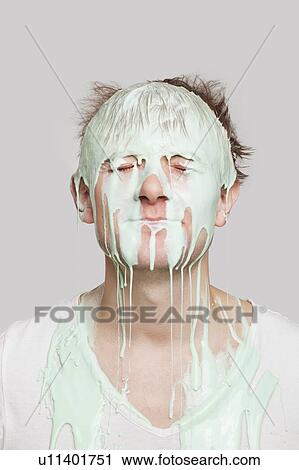 Paint dripping down a young Caucasian man's face against gray background View Large Photo Image Stock Image - Paint dripping down a young Caucasian man's face against gray background. Fotosearch