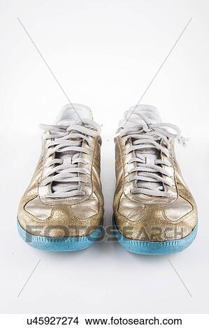 Pair of casual shoes over white background View Large Photo Image Picture - Pair of casual shoes over white background. Fotosearch