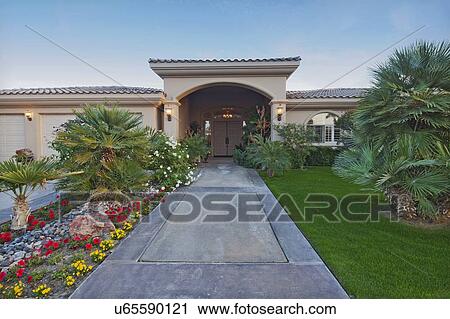 Stock Image - Path leading up to luxury bungalow. Fotosearch