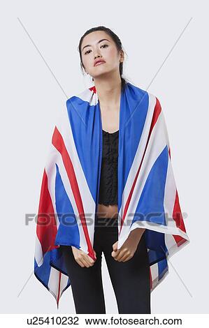 Patriotic young woman with British flag over white background View Large Photo Image Stock Image - Patriotic young woman with British flag over white background. Fotosearch