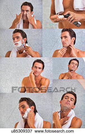 Stock Photo - Photo of attractive man shaving his beard in the bathroom. Fotosearch