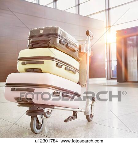 Picture - Photo of baggage on cart with lens flare. Fotosearch
