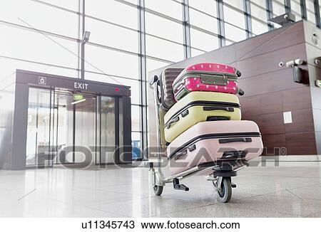 Photo of baggage on cart with lens flare View Large Photo Image Stock Image - Photo of baggage on cart with lens flare. Fotosearch