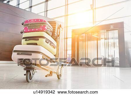 Photo of baggage on cart with lens flare View Large Photo Image Stock Image - Photo of baggage on cart with lens flare. Fotosearch