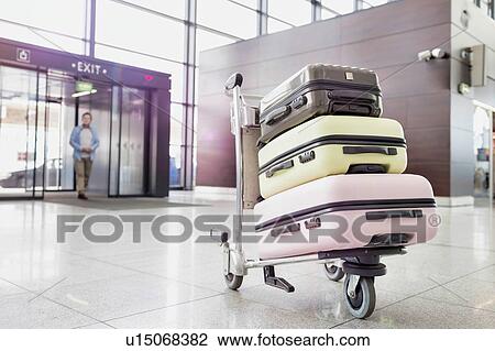 Photo of baggage on cart with lens flare View Large Photo Image Stock Image - Photo of baggage on cart with lens flare. Fotosearch
