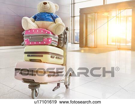 Stock Photo - Photo of baggage on cart with lens flare. Fotosearch