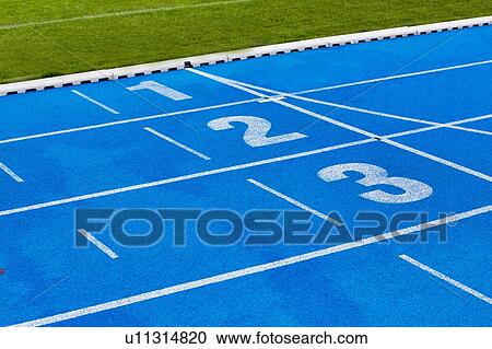 Stock Image - Photo of blue stadium tracks. Fotosearch