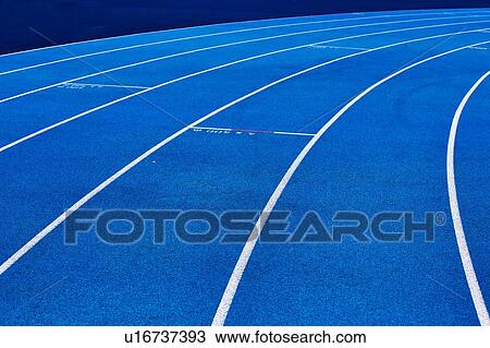 Stock Image - Photo of blue stadium tracks. Fotosearch