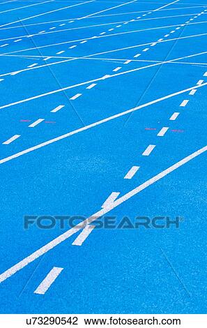 Stock Image - Photo of blue stadium tracks. Fotosearch