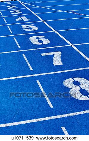 Stock Photo - Photo of blue stadium tracks. Fotosearch