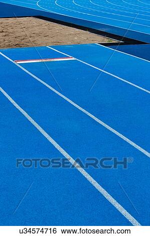Stock Photograph - Photo of blue stadium tracks. Fotosearch