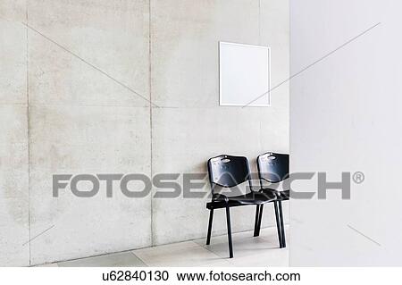 Stock Image - Photo of chairs in corridor at school. Fotosearch