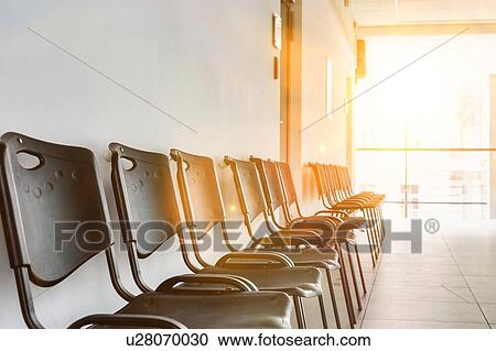 Stock Image - Photo of empty chairs waiting area in university. Fotosearch