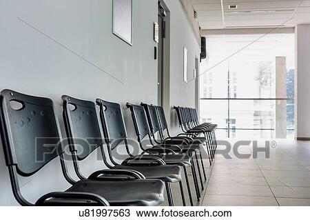Stock Image - Photo of empty chairs waiting area in university. Fotosearch