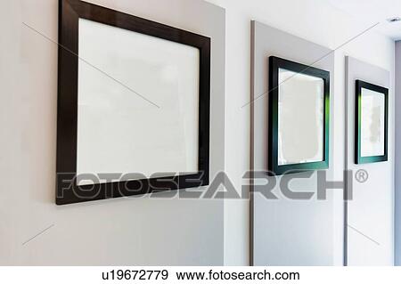 Stock Photo - Photo of empty picture frame in new apartment. Fotosearch