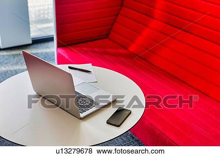 Photo of laptop and smartphone on table in office View Large Photo Image Stock Photo - Photo of laptop and smartphone on table in office. Fotosearch