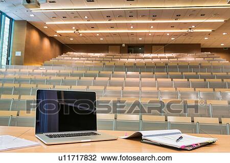 Photo of laptop on professor desk with tumbler in classroom View Large Photo Image Stock Image - Photo of laptop on professor desk with tumbler in classroom. Fotosearch