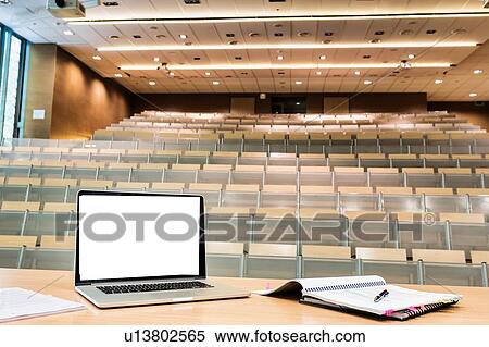 Photo of laptop on professor desk with tumbler in classroom View Large Photo Image Stock Photography - Photo of laptop on professor desk with tumbler in classroom. Fotosearch