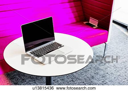Stock Photograph - Photo of laptop on table in office. Fotosearch