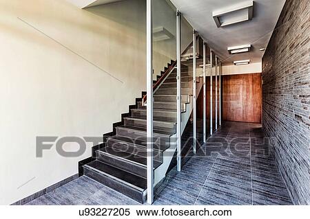 Photo of modern staircase in rental apartment business View Large Photo Image Stock Photography - Photo of modern staircase in rental apartment business. Fotosearch