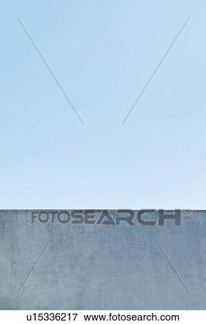 Stock Photo - Photo of office rooftop against blue clear sky. Fotosearch
