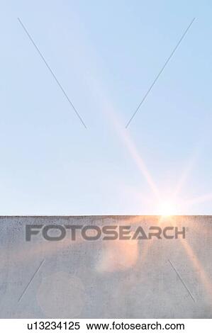 Stock Photography - Photo of office rooftop against blue clear sky. Fotosearch