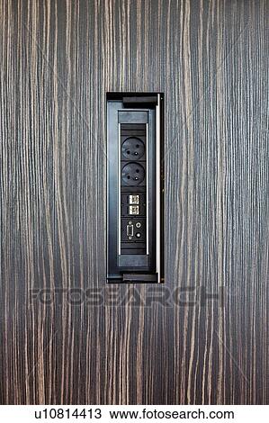 Stock Image - Photo of outlet plug in office. Fotosearch