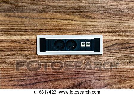 Stock Image - Photo of outlet plug in office. Fotosearch