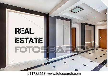 Stock Image - Photo of rental apartment business interior with real estate sign on the wall. Fotosearch
