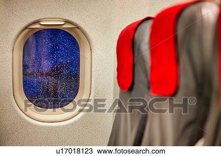 Photo of window seat in airplane View Large Photo Image Stock Image - Photo of window seat in airplane. Fotosearch