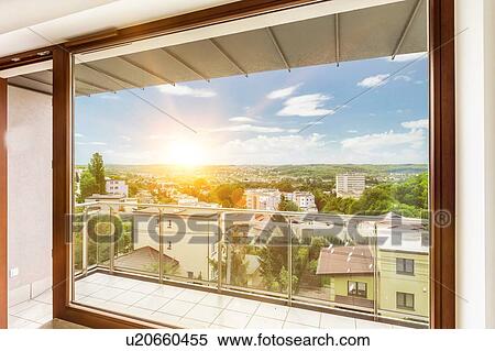 Stock Photography - Photo of window view inside apartment with lens flare in background. Fotosearch