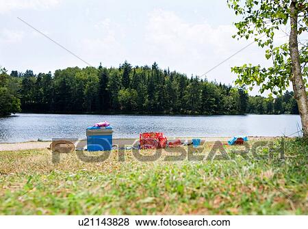 Picnic gear on lakeshore View Large Photo Image Stock Photo - Picnic gear on lakeshore. Fotosearch