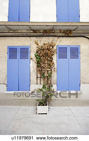 Stock Image - Picturesque outdoor shot of Parisian House. Fotosearch