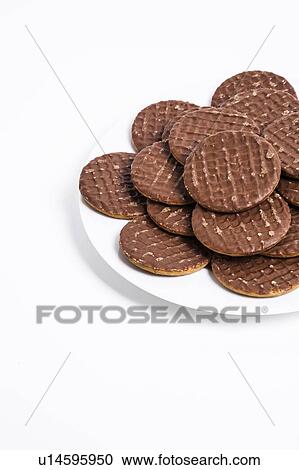 Plate full of chocolate biscuit over white background View Large Photo Image Stock Image - Plate full of chocolate biscuit over white background. Fotosearch