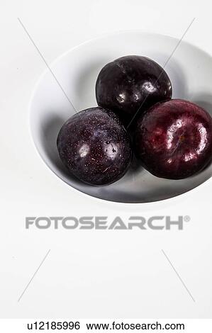 Stock Photograph - Plums in bowl. Fotosearch