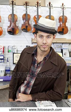 Picture - Portrait of a confident music store owner. Fotosearch