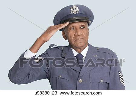 Portrait of a senior male US Air Force officer saluting over light blue background View Large Photo Image Stock Image - Portrait of a senior male US Air Force officer saluting over light blue background. Fotosearch