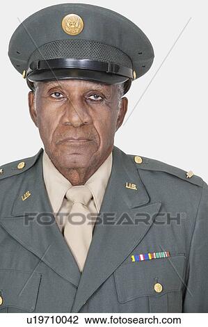 Portrait of a senior male US military officer over gray background View Large Photo Image Stock Image - Portrait of a senior male US military officer over gray background. Fotosearch